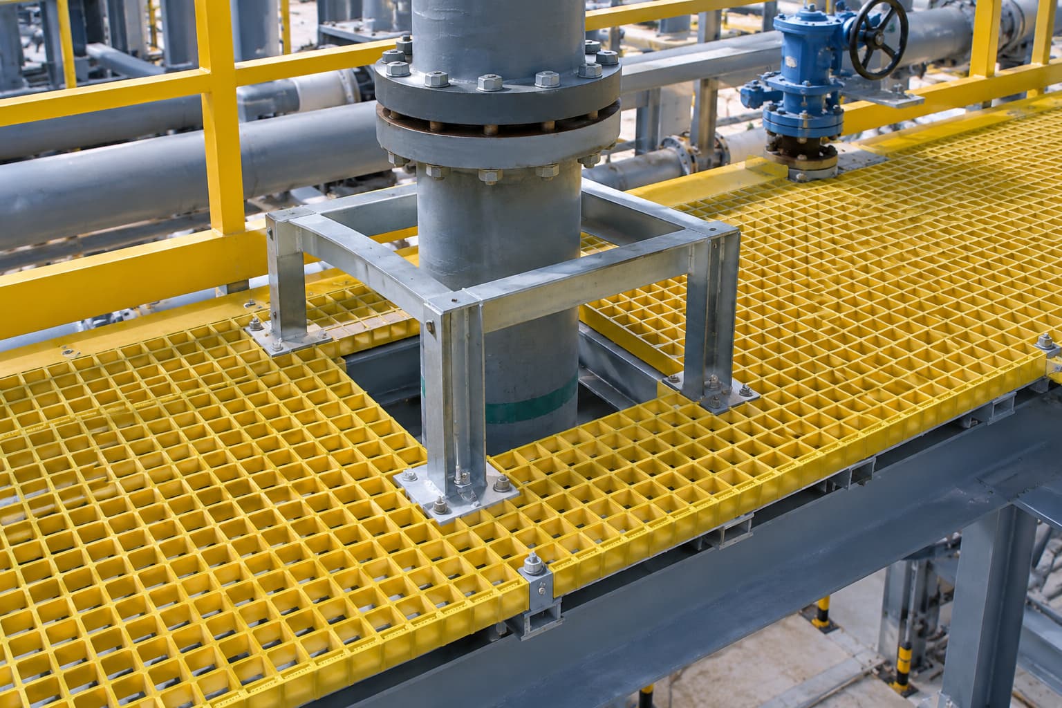 FRP grating panel with a properly designed cutout around an industrial pipe and supporting frame FRP grating panel with a properly designed cutout around an industrial pipe and supporting frame