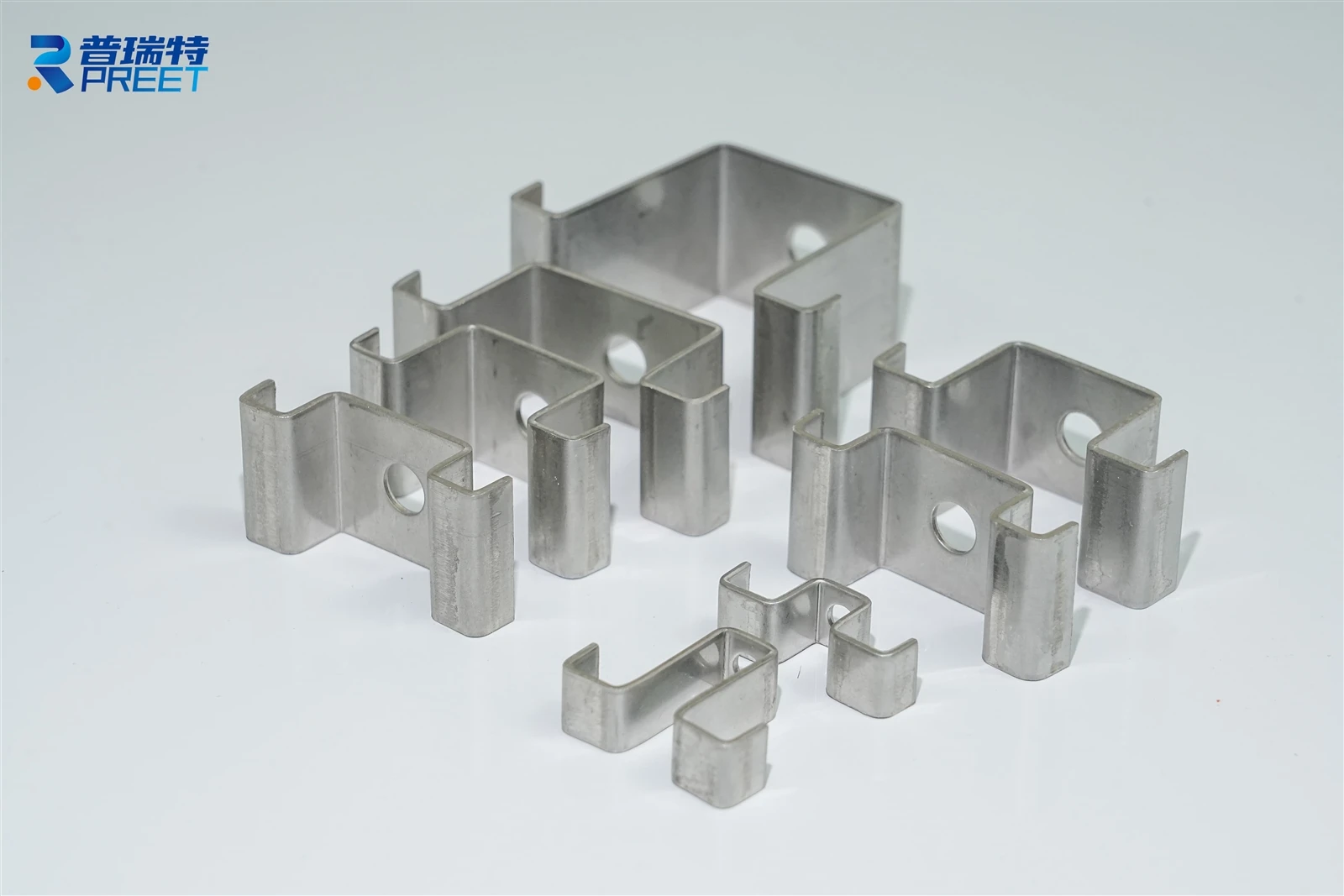 FRP grating fastening clips securing fiberglass grating panels to industrial support framing FRP grating fastening clips securing fiberglass grating panels to industrial support framing